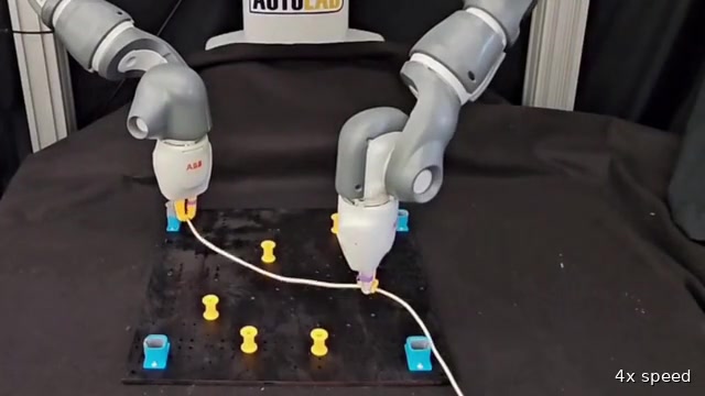 Two robot arms routing a cable around fixtures